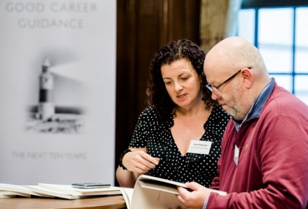 People consulting the good career guidance report