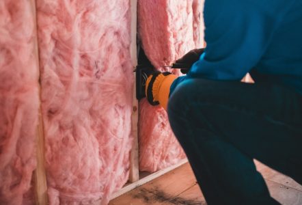 Insulation being installed in a building