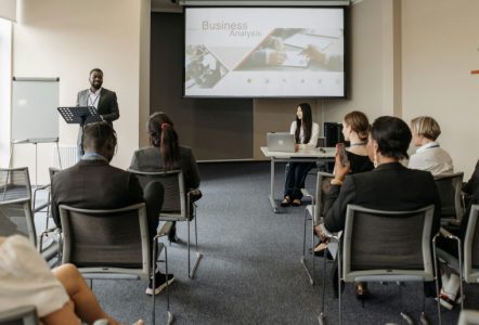A mean speaking at a business analysis seminar