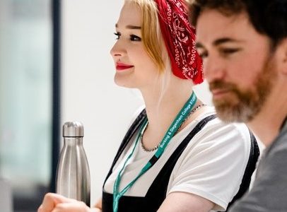 Young woman smiling in meeting