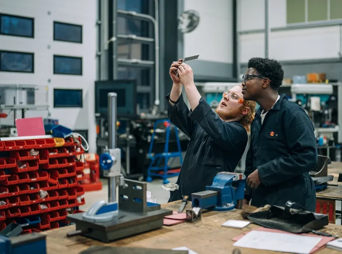 Two students in the workshop