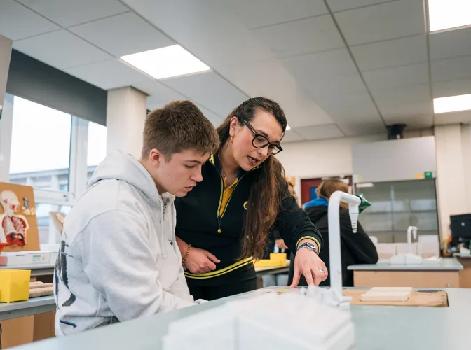 A teacher helping a student