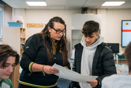 A teacher helping a student