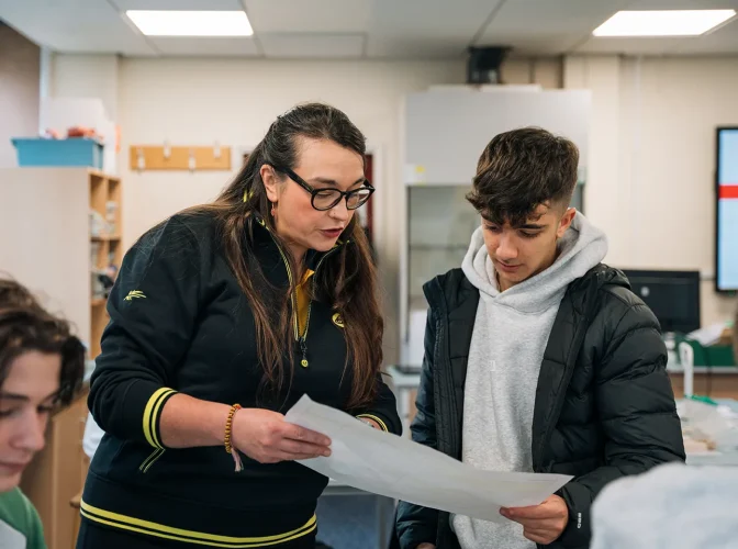 A teacher helping a student