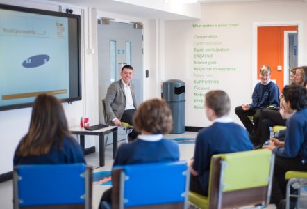 A teacher in front of a classroom