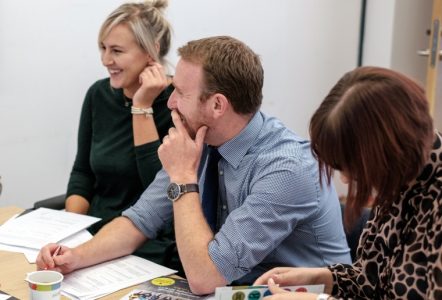 Discussion between adults in a meeting room