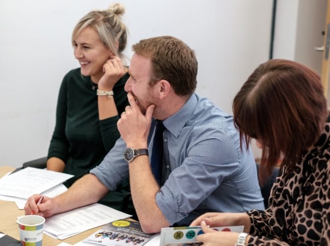 Discussion between adults in a meeting room