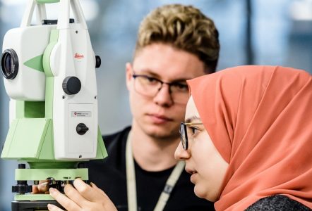 A student using a laser level device