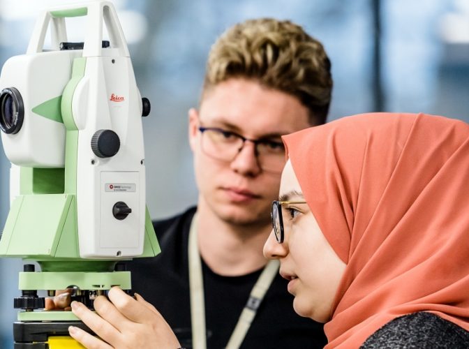 A student using a laser level device