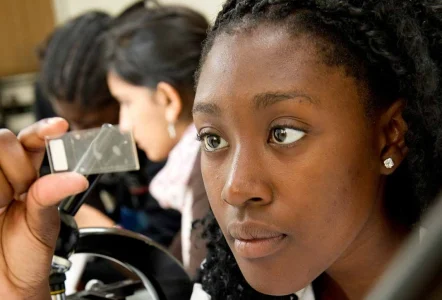 A female student inspecting samples in plant science class