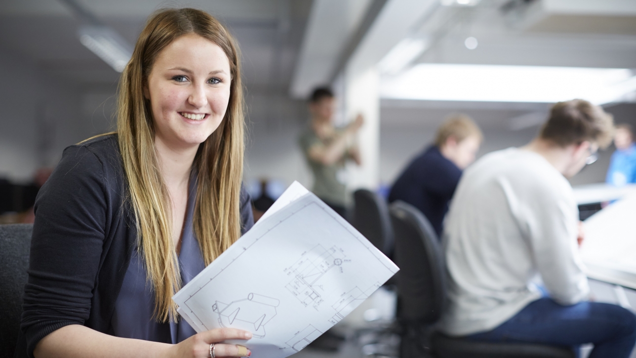 Female student with technical drawings